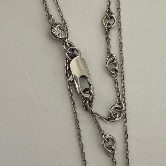 Henri Bendel  silver tone necklace with dark blue crystal and logo charms disc - Picture 4 of 9